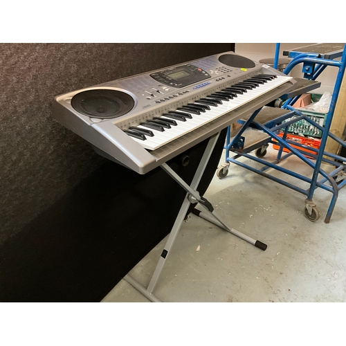 257 - CASIO ELECTRIC KEYBOARD WITH STAND