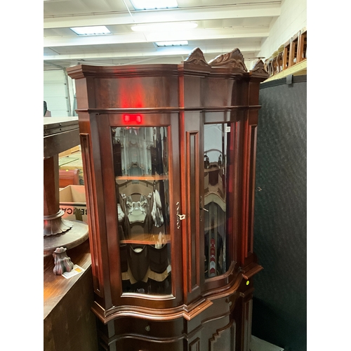 267 - REPRODUCTION MAHOGANY SERPENTINE FRONTED DISPLAY CABINET WITH 3 GLASS DOORS TO TOP 3 CENTRAL DRAWERS... 