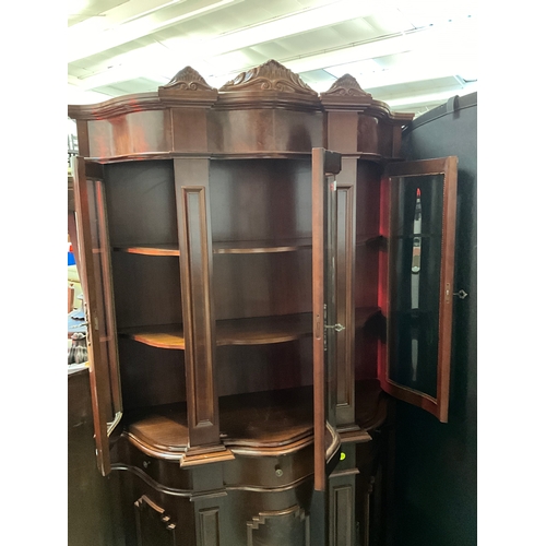 267 - REPRODUCTION MAHOGANY SERPENTINE FRONTED DISPLAY CABINET WITH 3 GLASS DOORS TO TOP 3 CENTRAL DRAWERS... 