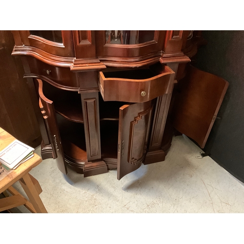 267 - REPRODUCTION MAHOGANY SERPENTINE FRONTED DISPLAY CABINET WITH 3 GLASS DOORS TO TOP 3 CENTRAL DRAWERS... 