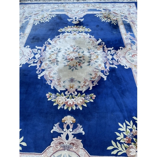 243 - GOOD QUALITY BLUE PATTERNED CARPET 149” x 108