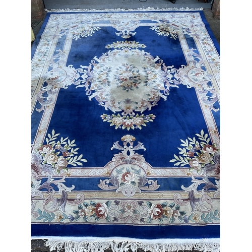 243 - GOOD QUALITY BLUE PATTERNED CARPET 149” x 108