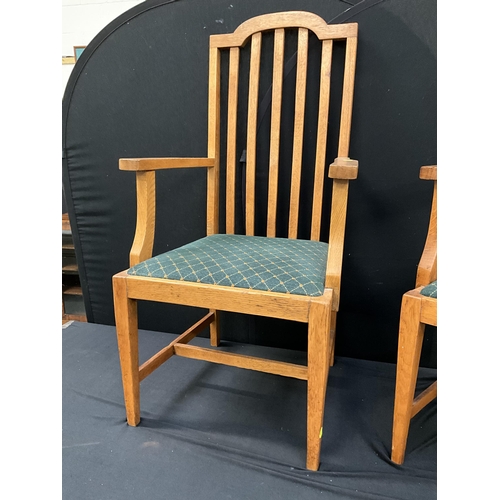 255 - PAIR OF LIGHT OAK RAILBACK VINTAGE ARMCHAIRS ON STRETCHERED LEGS WITH UPHOLSTERED SEATS