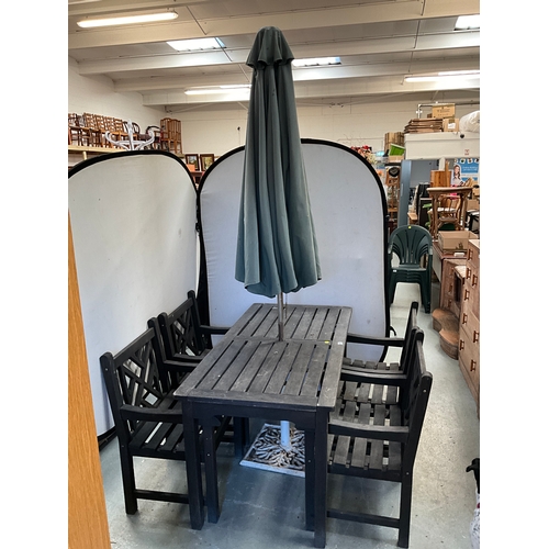 399 - WOODEN GARDEN TABLE 4 MATCHING ARMCHAIRS  AND UMBRELLA WITH CAST IRON STAND H30” W59” D30”