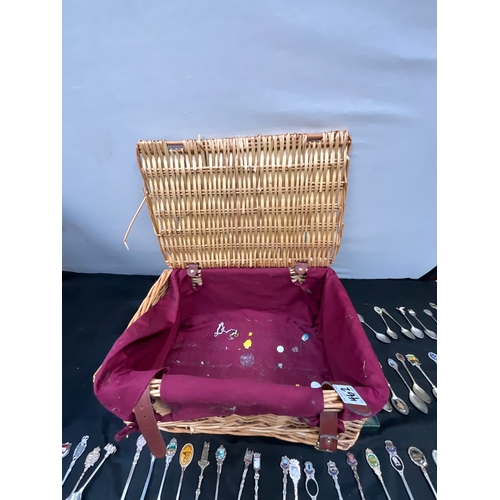 462 - COLLECTION OF SOUVENIR SPOONS IN PICNIC BASKET