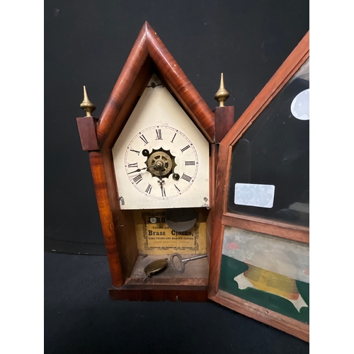 76 - AMERICAN MAHOGANY TEMPLE CLOCK WITH BRASS FINNIALS AND BEEHIVE DECORATION H15”