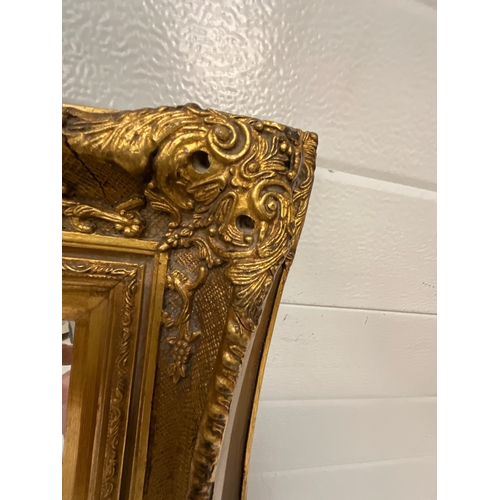 100 - GILT FRAMED BEVEL EDGED MIRROR 21”X25”