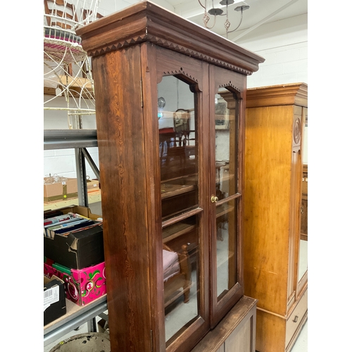 247 - GOTHIC REVIVAL PITCH PINE BOOKCASE WITH 2 GLAZED DOORS TO TOP AND 2 PANELLED DOORS TO BASE H90” W42”... 