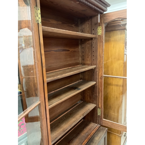 247 - GOTHIC REVIVAL PITCH PINE BOOKCASE WITH 2 GLAZED DOORS TO TOP AND 2 PANELLED DOORS TO BASE H90” W42”... 