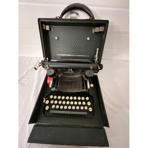 108 - VINTAGE CASED CORONA TYPEWRITER WITH BOOKLET