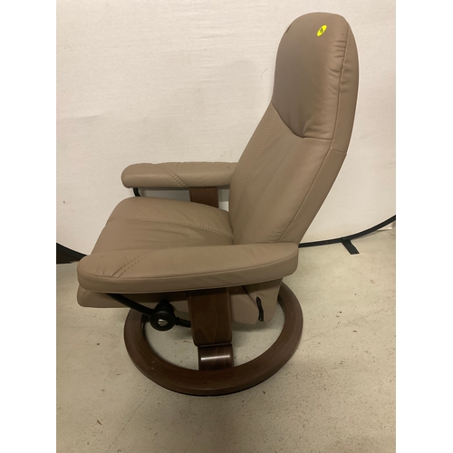 266 - STRESSLESS MUSHROOM COLOURED LEATHER SWIVEL AND RECLINING CHAIR COMPLETE WITH MATCHING FOOT STOOL