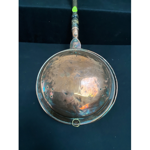 129 - COPPER WARMING PAN WITH TURNED HANDLE L40”