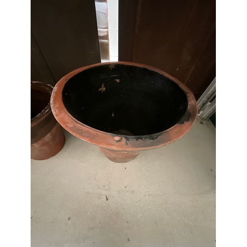 210 - TWO LARGE TWIN HANDLED  TERRACOTTA GARDEN POTS H18”DIA19” AND A MEDIUM ONE