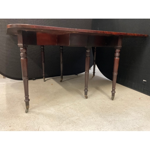 292 - GEORGIAN FLAMED MAHOGANY FDROP LEAF GATELEG DINING TABLE ON 6 LEGS WITH ORIGINAL BRASS CASTORS H29” ... 