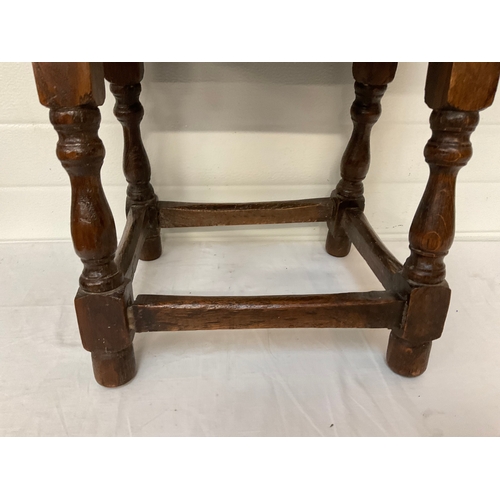 296 - OAK PEGGED AND DOWELLED STRETCHERED STOOL ON TURNED LEGS H18” W18” D12” A/F