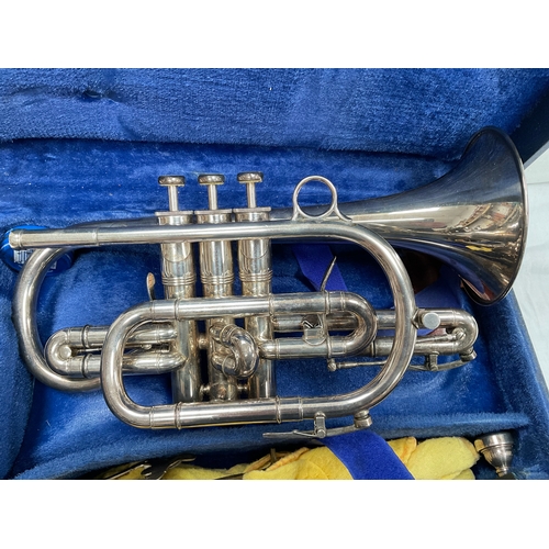 25 - BOOSEY AND HAWKES LONDON CORNET IN CASE WITH 2 MOUTH PIECES AND MUSIC STAND