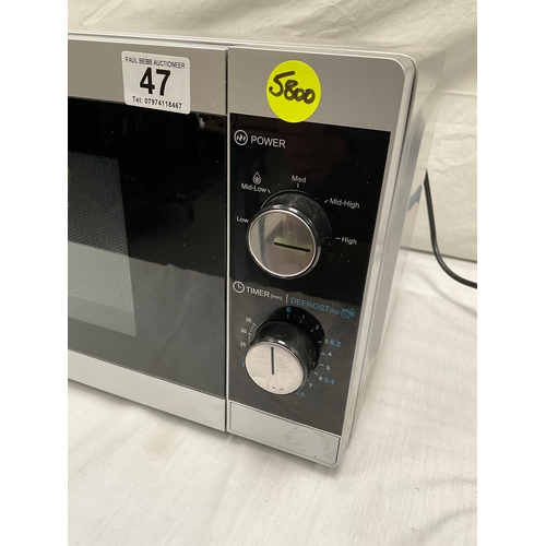 47 - SILVER SHARP MICROWAVE WITH INSTRUCTIONS