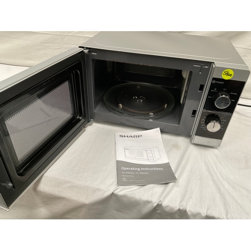 47 - SILVER SHARP MICROWAVE WITH INSTRUCTIONS