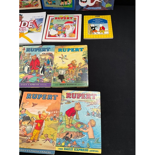 63 - COLLECTION OF VINTAGE RUPERT THE BEAR BOOKS AND 2 BOXED LORRIES