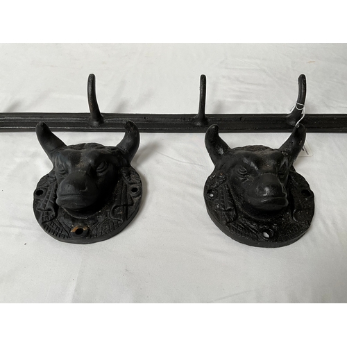 75 - CAST IRON WALL COAT HOOKS L28” AND 2 BULLS HEAD PLAQUES