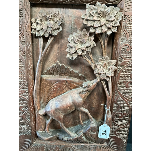 76 - CARVED MAHOGANY PANEL DEPICTING DEER FEEDING IN FOREST MOUNTED IN CARVED MAHOGANY FRAME 23” x 15”