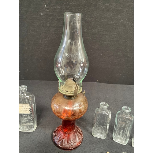 88 - VINTAGE COLOURED GLASS OIL LAMP AND VINTAGE MEDICINE BOTTLES