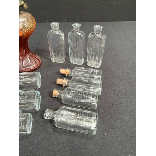 88 - VINTAGE COLOURED GLASS OIL LAMP AND VINTAGE MEDICINE BOTTLES