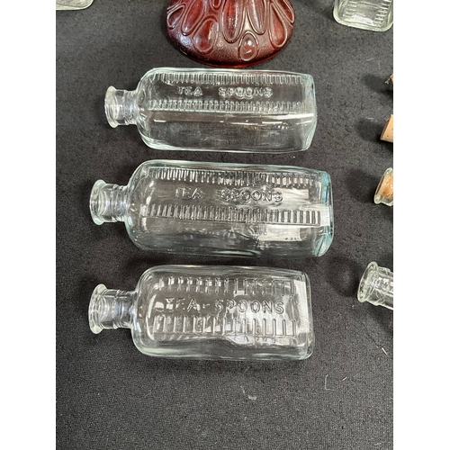 88 - VINTAGE COLOURED GLASS OIL LAMP AND VINTAGE MEDICINE BOTTLES