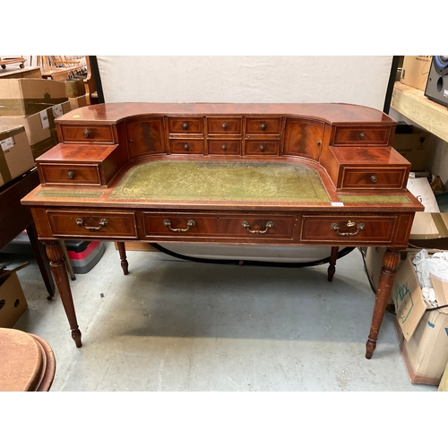 500 - REPRODUCTION MAHOGANY VENEERED WITH LEATHER INSET TOP AND GALLERY BAVK WRITING DESK A/F H38” 55” D28... 