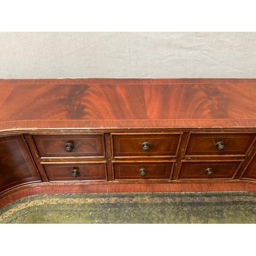 500 - REPRODUCTION MAHOGANY VENEERED WITH LEATHER INSET TOP AND GALLERY BAVK WRITING DESK A/F H38” 55” D28... 