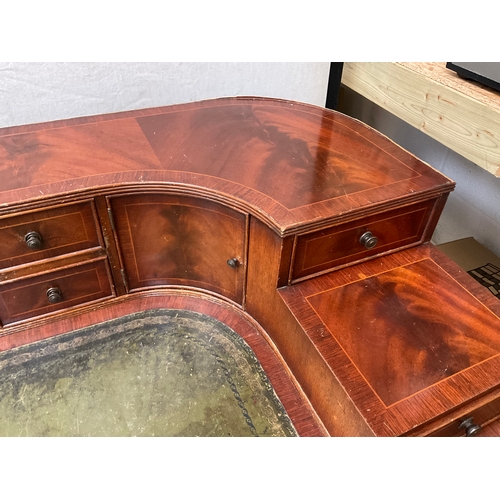 500 - REPRODUCTION MAHOGANY VENEERED WITH LEATHER INSET TOP AND GALLERY BAVK WRITING DESK A/F H38” 55” D28... 