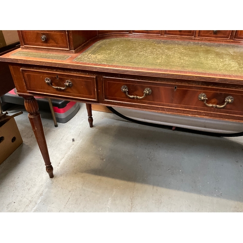 500 - REPRODUCTION MAHOGANY VENEERED WITH LEATHER INSET TOP AND GALLERY BAVK WRITING DESK A/F H38” 55” D28... 