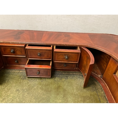 500 - REPRODUCTION MAHOGANY VENEERED WITH LEATHER INSET TOP AND GALLERY BAVK WRITING DESK A/F H38” 55” D28... 