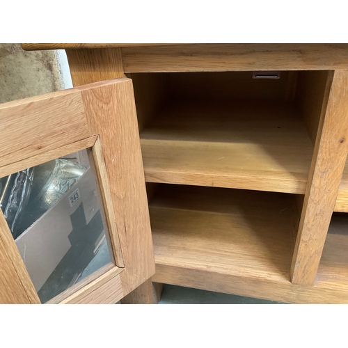 507 - MODERN OAK TV STAND WITH DOOR AND AND 2 SHELVES H20” W36” D17”