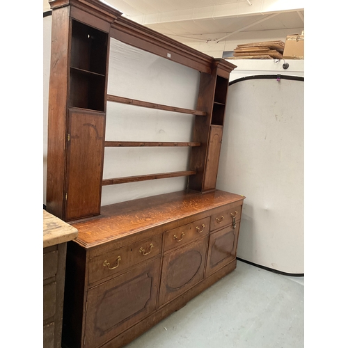 510 - EARLY OAK AND MAHOGANY CROSS BANDED DRESSER WITH OPEN SHELVED RACK TO TOP FLANKED BY 2 DOORS - BASE ... 