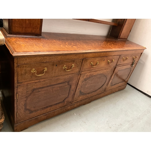 510 - EARLY OAK AND MAHOGANY CROSS BANDED DRESSER WITH OPEN SHELVED RACK TO TOP FLANKED BY 2 DOORS - BASE ... 