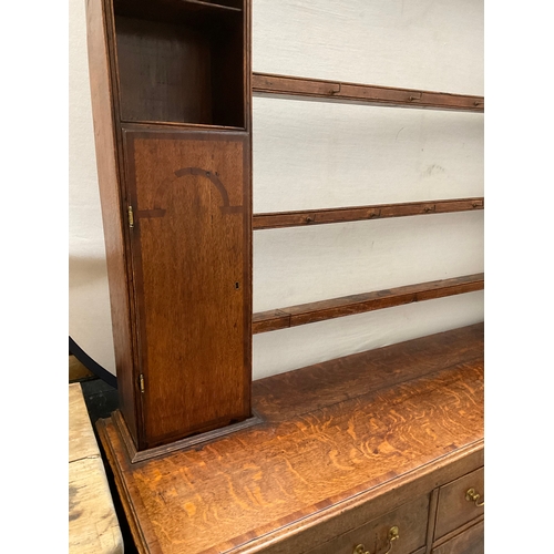 510 - EARLY OAK AND MAHOGANY CROSS BANDED DRESSER WITH OPEN SHELVED RACK TO TOP FLANKED BY 2 DOORS - BASE ... 