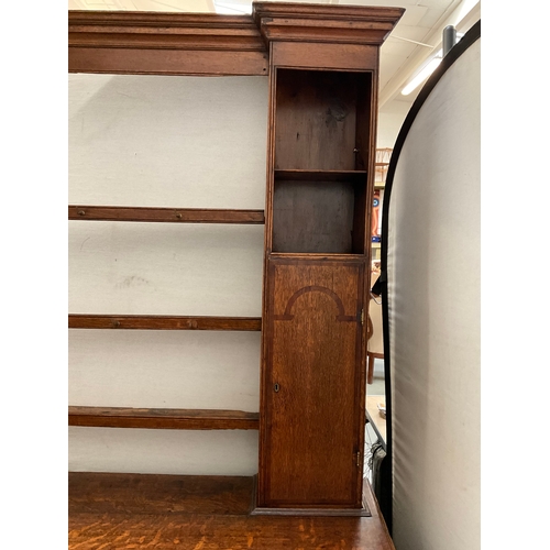 510 - EARLY OAK AND MAHOGANY CROSS BANDED DRESSER WITH OPEN SHELVED RACK TO TOP FLANKED BY 2 DOORS - BASE ... 