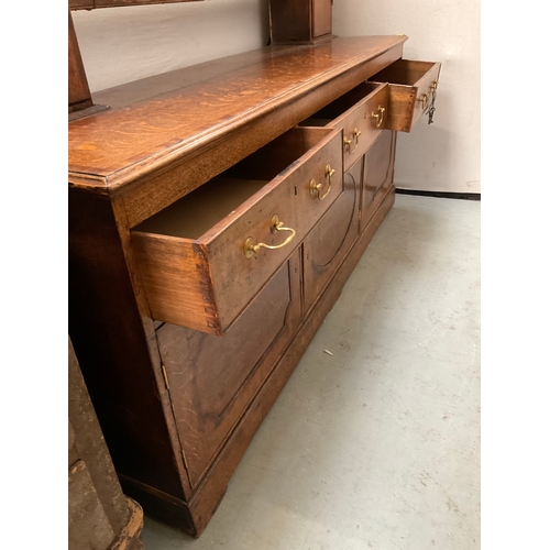 510 - EARLY OAK AND MAHOGANY CROSS BANDED DRESSER WITH OPEN SHELVED RACK TO TOP FLANKED BY 2 DOORS - BASE ... 