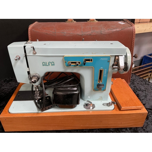 27 - TWO VINTAGE ELECTRIC SEWING MACHINES WITH ORIGINAL CASES - SINGER AND ALFA