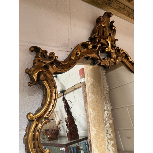 126 - REPRODUCTION GILT FRAMED ORNATE WALL MIRROR 46” x 23”