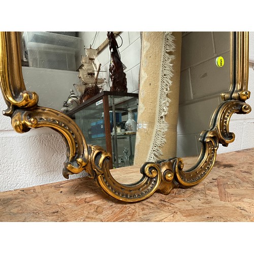 126 - REPRODUCTION GILT FRAMED ORNATE WALL MIRROR 46” x 23”