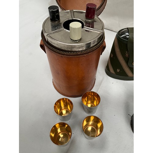 135 - THREE SECTIONAL LEATHER CASED DRINKS FLASK COMPLETE WITH STIRRUP CUPS, THREE HIP FLASKS AND TWO LEAT... 