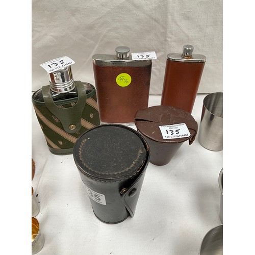 135 - THREE SECTIONAL LEATHER CASED DRINKS FLASK COMPLETE WITH STIRRUP CUPS, THREE HIP FLASKS AND TWO LEAT... 