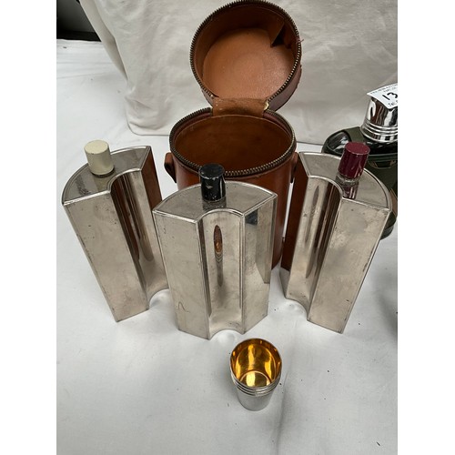 135 - THREE SECTIONAL LEATHER CASED DRINKS FLASK COMPLETE WITH STIRRUP CUPS, THREE HIP FLASKS AND TWO LEAT... 