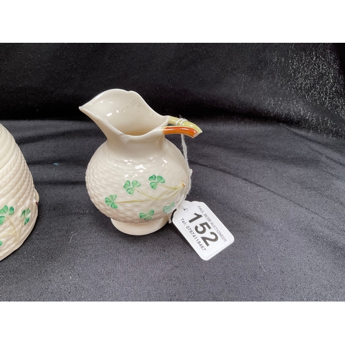 152 - FIVE PIECES OF BELLEEK CHINA TO INCLUDE TWO SHELL PIECES AND FOUR DECORATED PIECES - JUG IS A/F