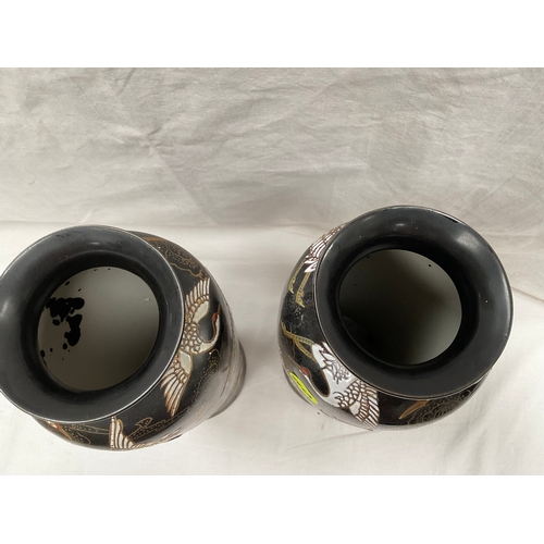 162 - PAIR OF BALCK DECORATED WITH BIRDS VASES BADGED ICEBERG 14” DIA 5”