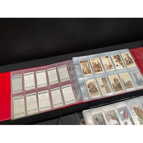 23 - CRATE WITH 4 ALBUMS OF CIGARETTE CARDS OF VARIOUS AGES AND SUBJECTS