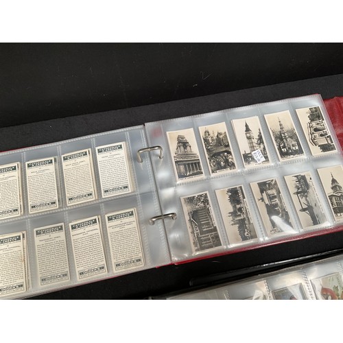 23 - CRATE WITH 4 ALBUMS OF CIGARETTE CARDS OF VARIOUS AGES AND SUBJECTS