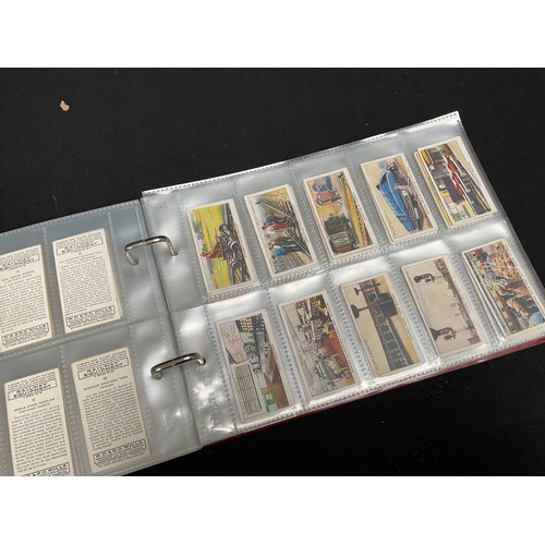 23 - CRATE WITH 4 ALBUMS OF CIGARETTE CARDS OF VARIOUS AGES AND SUBJECTS